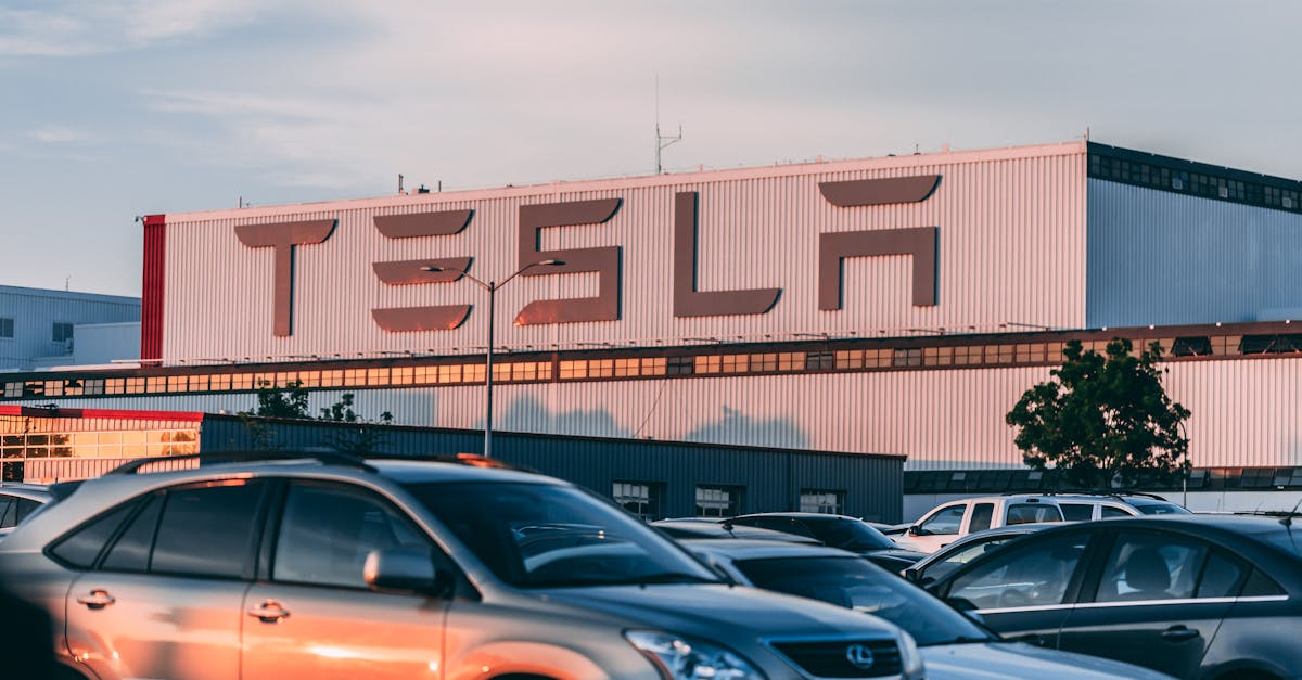 Cars Parked In Front Of Company Building