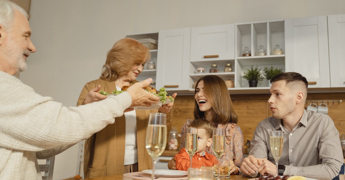 Woman in White Sweater Sitting Beside Woman in White Sweater