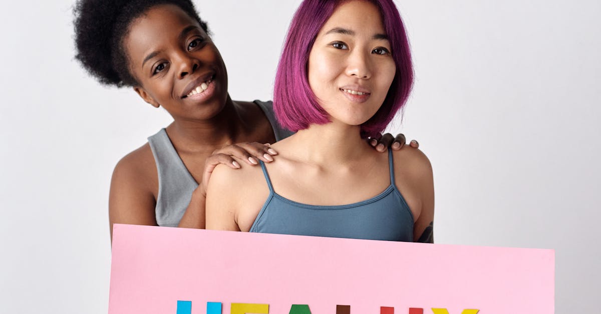 Two Women Holding a Slogan About Healthy Habits