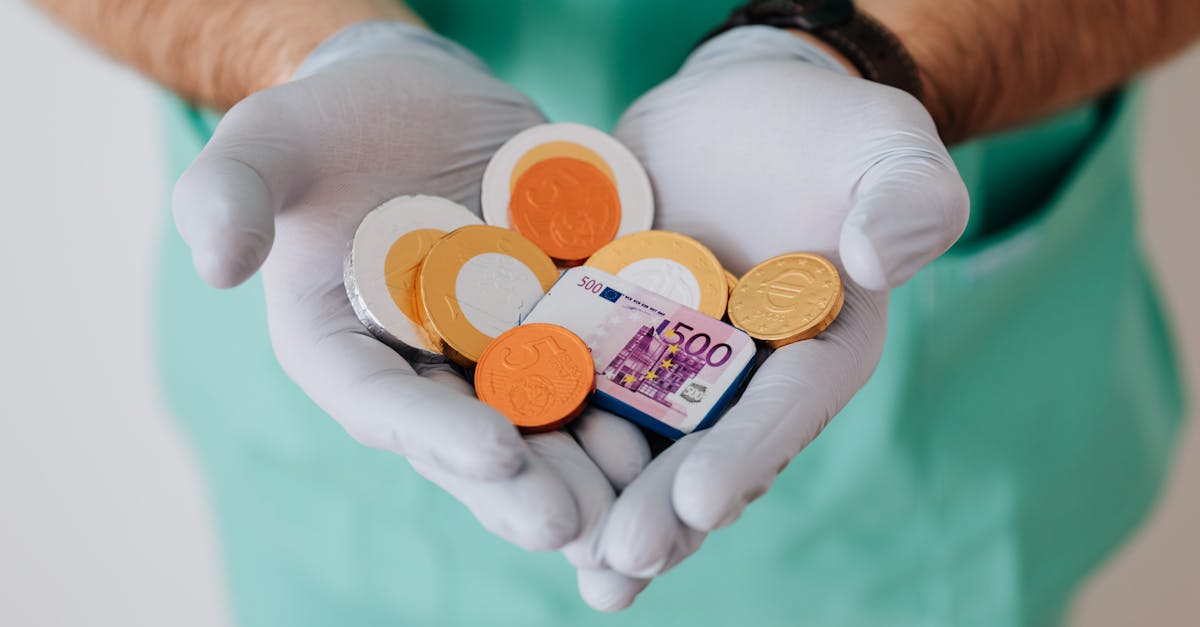 Faceless doctor with chocolate coins in hands