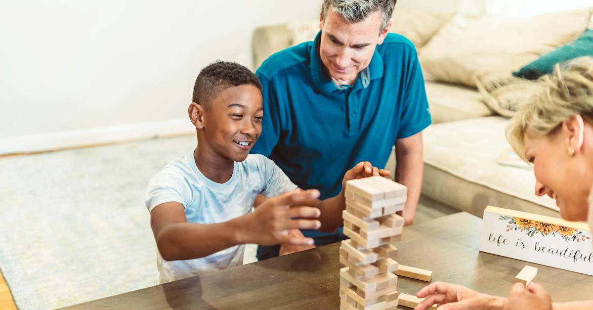 A Happy Family Playing Jenga in the Living Room