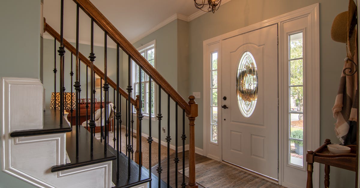 Brown Wooden Staircase With Brass Chandelier