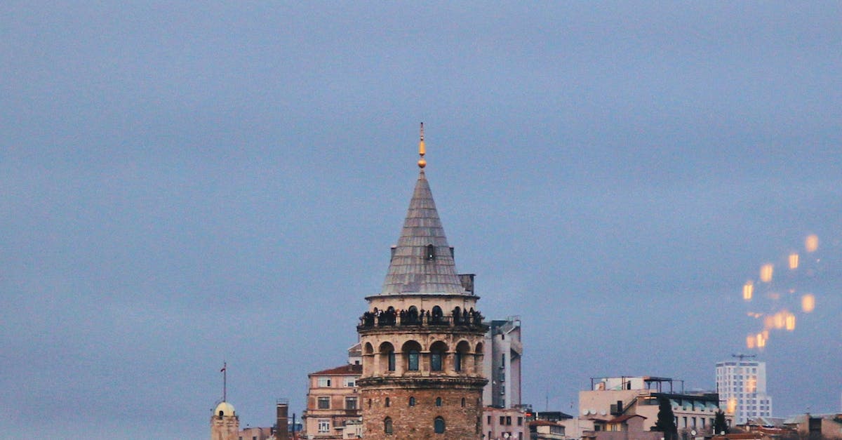 A city skyline with lights hanging from the sky