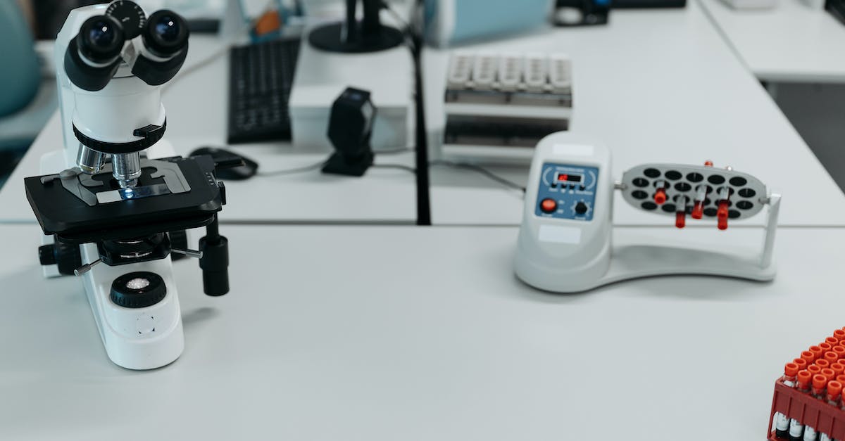 Black and Gray Video Camera on White Table