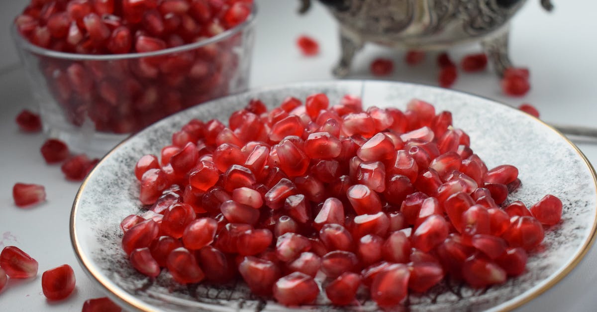 Red Round Fruits on White Glass Bowl