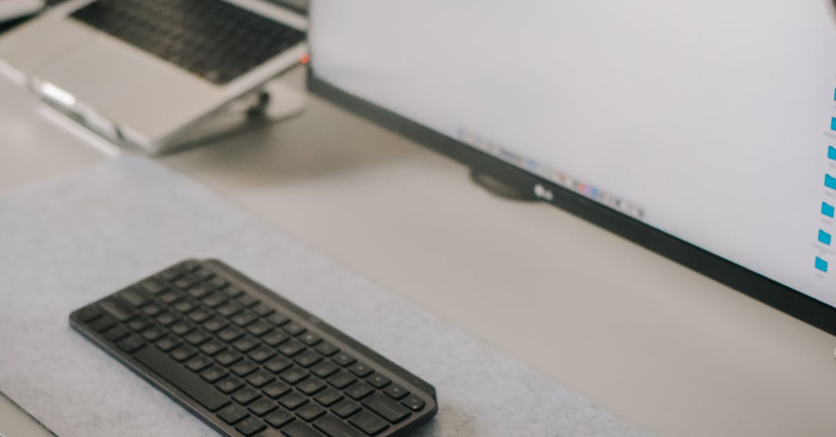 Monitor and a Keyboard on a Desk 