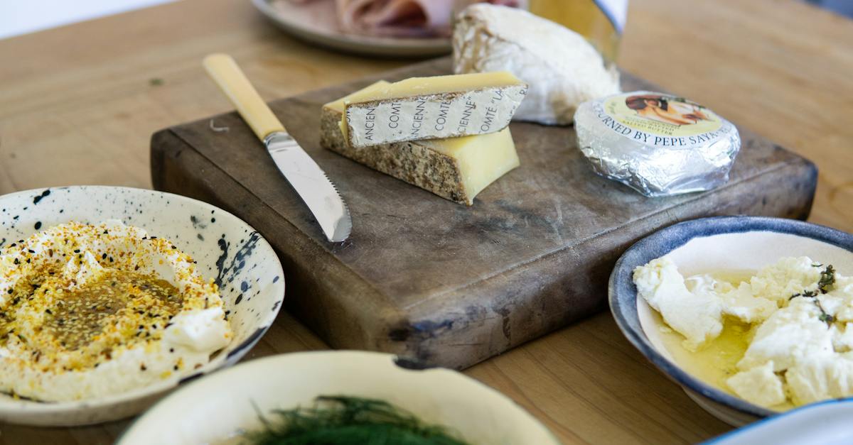 Three Assorted Varieties of Cheese Near Tableknife