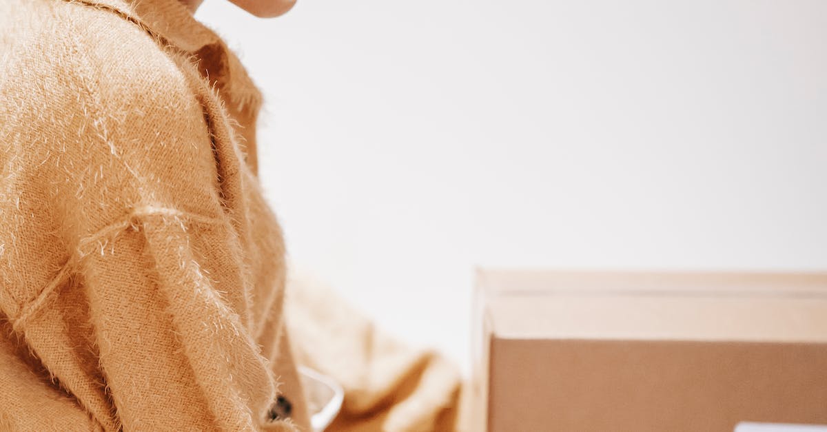 Young woman with delivered carton boxes