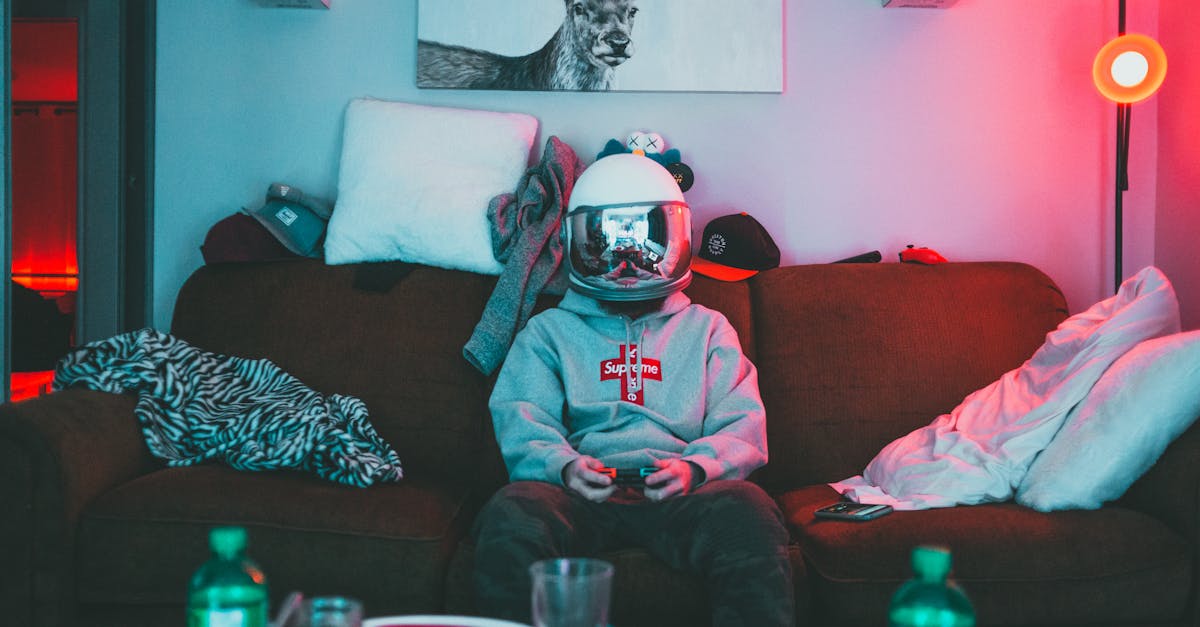 Boy in virtual reality helmet playing joystick