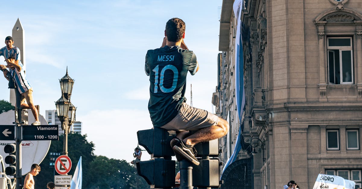 Man in Messi Jersey Celebrating Winning FIFA World Cup 2022 on Street of Buenos Aires, Argentina